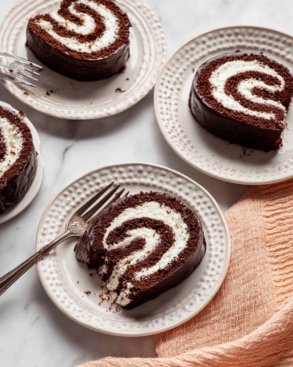 A close-up of four slices of a chocolate roll cake with white cream swirled inside, placed on four white plates with different patterns. The cake has a dark chocolate outer layer with a smooth, shiny texture, and bright white cream spirals evenly inside, creating a contrasting pattern. One slice on a plain white plate has a piece taken with a fork showing moist chocolate cake and fluffy cream, while the other slices stay whole. The background is a white marbled surface, and a light peach textured cloth is visible on the lower right side. photo taken with an iphone --ar 4:5 --v 7