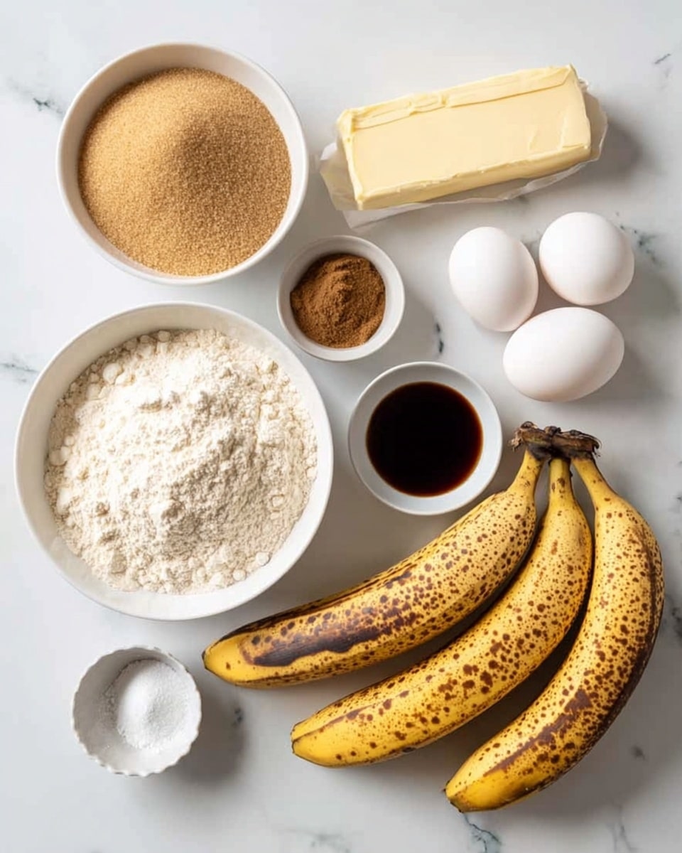A white marbled surface holds various baking ingredients arranged neatly: a white bowl filled with light brown sugar, another white bowl with white flour, a stick of pale yellow butter wrapped in paper, two whole eggs placed upright side by side, a small white bowl with dark brown vanilla extract, a small white bowl containing cinnamon powder, a tiny white bowl with white baking soda, and a bunch of five ripe bananas with brown spots laying together on the right side. photo taken with an iphone --ar 4:5 --v 7