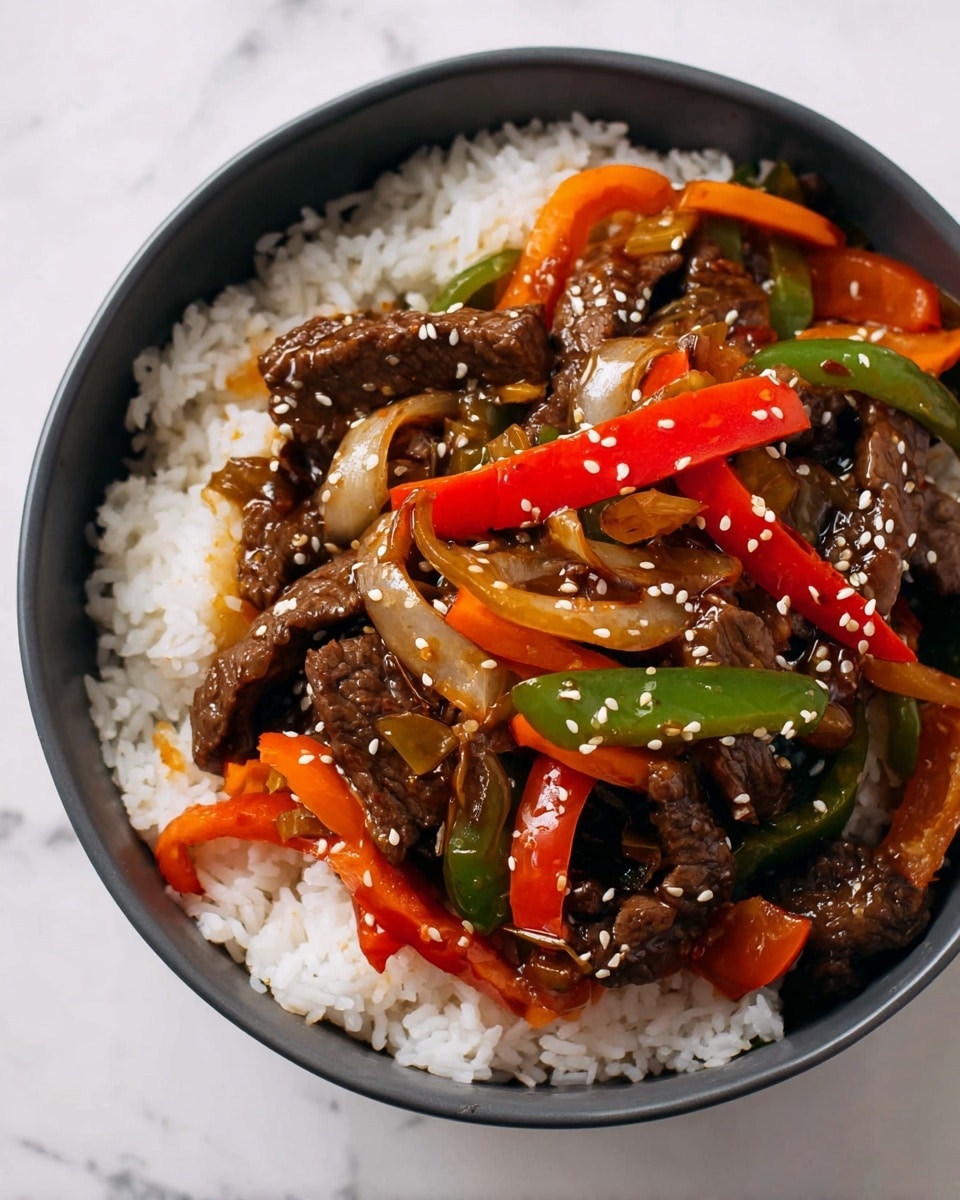 A bowl filled with soft white rice sits at the bottom as the first layer, topped with a stir-fry mix of tender brown beef slices, bright orange and red bell pepper strips, green pepper pieces, and translucent cooked onion slices. The stir-fry is glossy with sauce and sprinkled with small white sesame seeds, adding texture and contrast. The bowl is white, and the background shows a white marbled surface. photo taken with an iphone --ar 4:5 --v 7