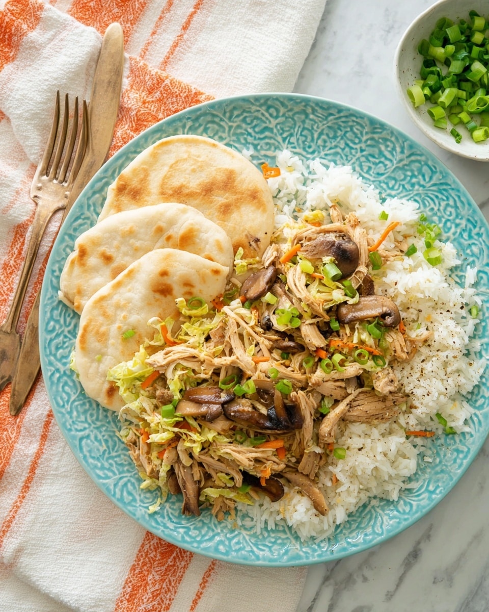 A light blue plate with a detailed pattern holds a dish made of three layers: the bottom layer is white rice with a soft, fluffy texture, the middle layer is a mix of light brown shredded cooked chicken, sliced dark brown mushrooms, thin orange carrot strips, and light green chopped cabbage, all sprinkled with bright green chopped scallions and black pepper, and on one side of the plate there are two folded, pale beige flatbreads with faint brown spots. Two bronze forks rest on the left side of the plate, and a small white bowl with chopped green scallions is visible in the top right corner, all placed on a white marbled surface with an off-white cloth that has orange stripes nearby photo taken with an iphone --ar 4:5 --v 7