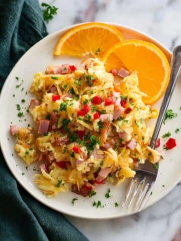 Creamy Breakfast Hash with Ham, Bell Peppers, Eggs, and Cheddar Recipe