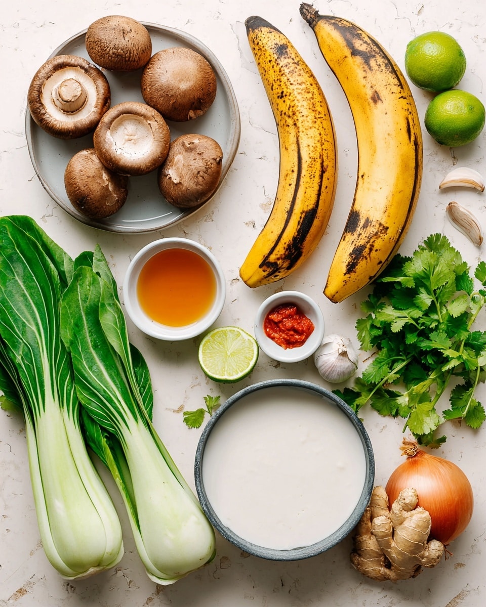 The image shows a flat lay of fresh cooking ingredients arranged neatly on a white marbled surface. In the top left corner, there is a white plate holding smooth brown mushrooms. Next to it, on the right, are two ripe plantains with one partially peeled, revealing a soft yellow inside and dark brown spots on the skin. Below the mushrooms, vibrant green bok choy leaves with white stalks stretch diagonally. Moving clockwise, there are two lime wedges with bright green skin and juicy flesh. A small white bowl with amber liquid, likely honey, sits in the center left. A little below and to the right, a white bowl holds a dollop of bright red paste. Below this is a gray-rimmed white bowl filled with creamy white coconut milk or similar liquid. Two cloves of garlic rest just above the bowl, and fresh green cilantro leaves are at the top right corner. A fresh yellow ginger root with its irregular texture is placed to the bottom right of the coconut milk bowl, and an orange shallot sits at the bottom edge. The overall look is colorful, fresh, and organized, perfect for a recipe setup. photo taken with an iphone --ar 4:5 --v 7