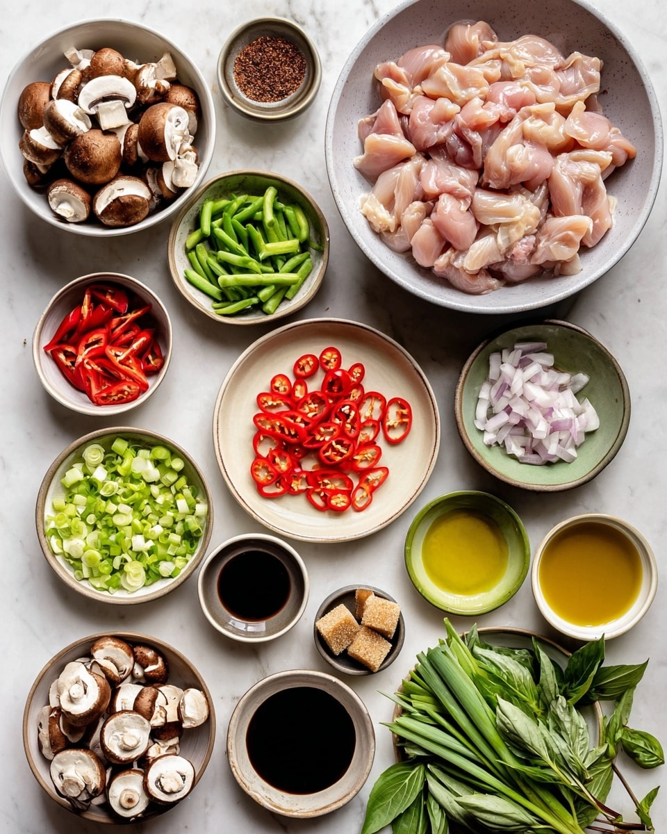The image shows an overhead view of many small bowls and plates of cooking ingredients arranged on a white marbled surface. In the center is a large white plate filled with halved brown mushrooms showing their white flesh. Surrounding it are smaller white bowls holding chopped red bell peppers, sliced shallots, chopped green beans, and thick-cut green onions. A beige plate in the middle contains red chili peppers and thin circular slices of garlic. There is a large grey bowl filled with raw pink chicken pieces. Other small vessels hold dark soy sauce, a lighter sauce, thick black sauce, olive oil, and two palm sugar lumps in a small green bowl. Fresh green and purple basil leaves are on the lower right side. The colors of the ingredients are warm reds, bright greens, pale mushrooms, and pink chicken, all neatly prepared. photo taken with an iphone --ar 4:5 --v 7