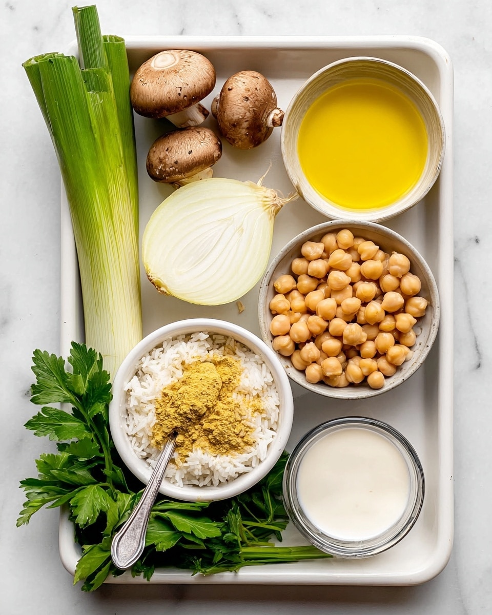 The image shows a white rectangular tray with several ingredients neatly arranged. On the top left, there is a long green stalk beside three brown mushrooms and a half-sliced white onion. On the top right corner, there is a small bowl filled with yellow liquid. Below that, there is another small bowl full of round, beige chickpeas. On the bottom right, there is a small glass bowl filled with white creamy liquid. To the left of that, a small white bowl contains uncooked white rice topped with a metal spoon holding a mound of yellow powder. Fresh green parsley leaves are placed at the bottom left corner. All of this is set on a white marbled surface. Photo taken with an iphone --ar 4:5 --v 7