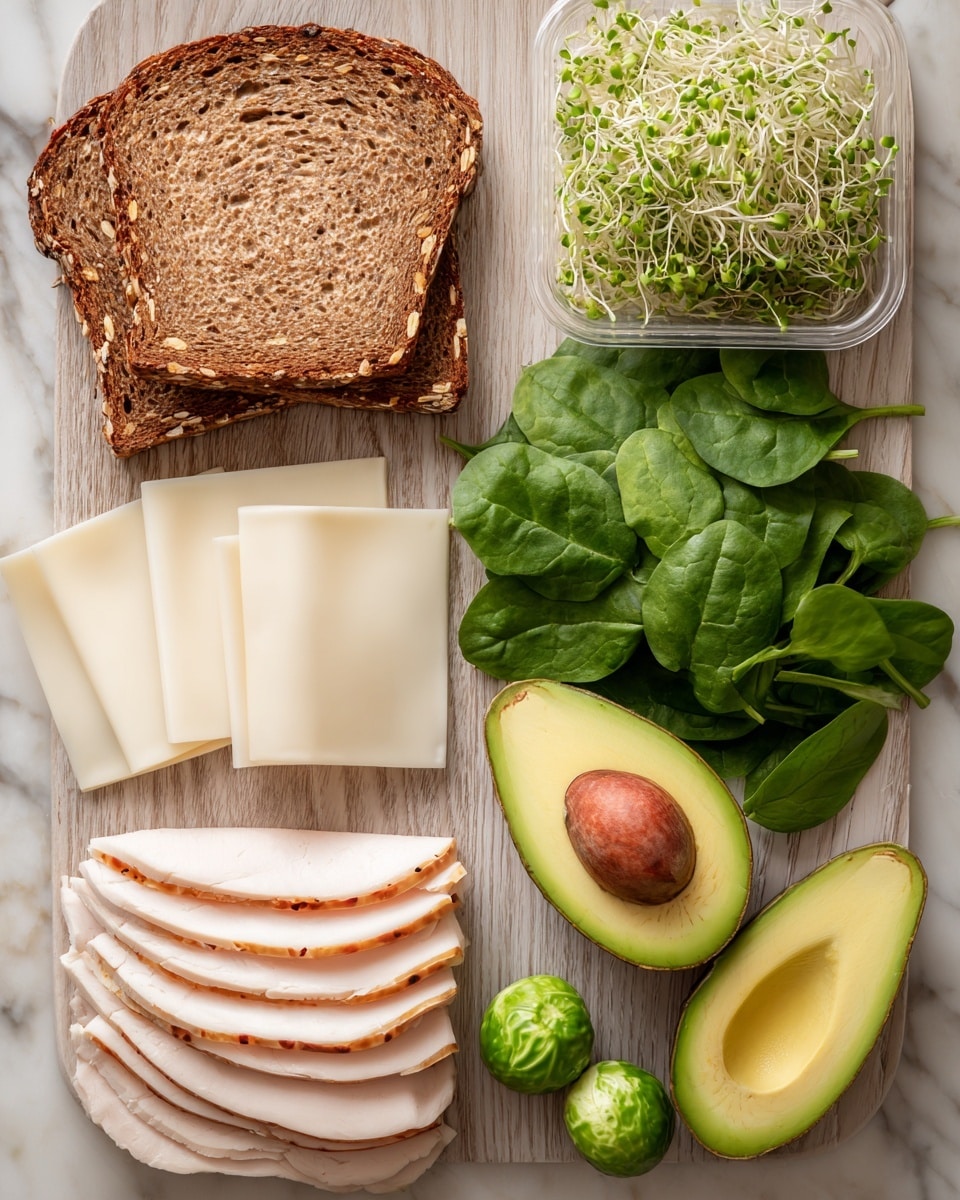 The image shows sandwich ingredients neatly placed on a light wooden surface. Two slices of multigrain bread with a brown crust lie side by side on the upper left. Below the bread, there is a stack of white cheese slices and to its right, several slices of light-colored deli turkey with small red seasoning spots. Above the cheese and turkey, there is a container with green sprouts. To the right of the bread and meat, fresh dark green spinach leaves are spread out, with two small round green tomatillos nearby. Finally, two avocado halves are placed at the bottom right, one showing bright green flesh with the seed, the other with the seed removed, revealing smooth yellow-green flesh inside. The background is a white marbled texture. photo taken with an iphone --ar 4:5 --v 7