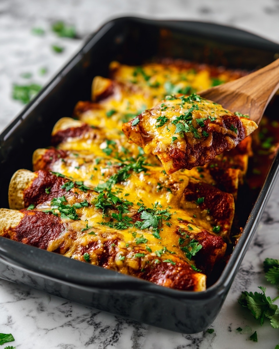 A black baking dish filled with rolled tortillas placed side by side, forming a single bottom layer with light brown, slightly textured surfaces. The tortillas are covered with a thick layer of rich, dark red tomato sauce, spread unevenly around the edges. On top of the sauce is a generous layer of melted yellow and white cheese, gooey and slightly browned in places, creating a bumpy texture. Fresh green chopped cilantro is sprinkled on top, adding a fresh, leafy look. A wooden spoon lifts one tortilla from the right side. The dish sits on a white marbled surface with small green cilantro leaves scattered nearby. Photo taken with an iphone --ar 4:5 --v 7