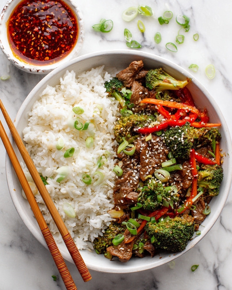 A white bowl filled with two main layers: on the left, a thick bed of fluffy white rice with some green onion pieces scattered on top, and on the right, a colorful stir-fry mix with small pieces of light brown meat, bright green broccoli, thin orange carrot strips, red pepper slices, and more green onions, all sprinkled with white sesame seeds; two wooden chopsticks rest on the bowl's edge; above the bowl, a small white dish holds a chunky reddish-brown sauce with visible seeds; the bowl sits on a white marbled surface with some green onion pieces and sesame seeds scattered around; photo taken with an iphone --ar 4:5 --v 7