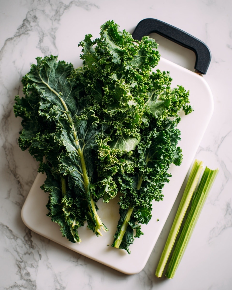 A white cutting board with a black handle is placed on a white marbled surface. On the board there is a pile of fresh kale leaves, bright green in color with curly edges and varied textures, some leaves more ruffled than others. Two long kale stems, stripped of leaves, lie next to the pile on the right side of the cutting board. The lighting is soft and natural, highlighting the fresh, vibrant green of the kale against the clean white of the cutting board and the light marbled background. photo taken with an iphone --ar 4:5 --v 7