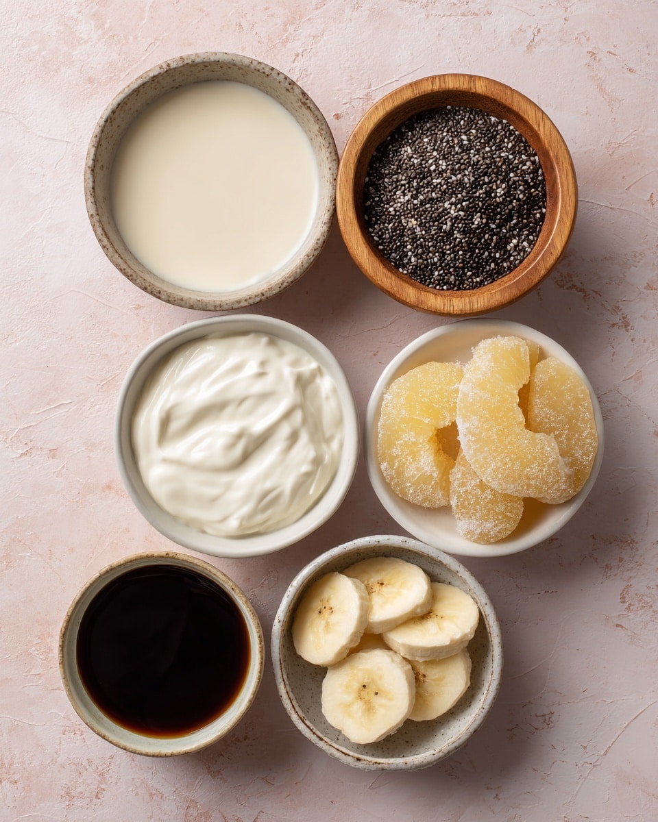 The image shows six small bowls on a soft pink background with a white marbled texture. The largest bowl at the top left holds a smooth, creamy white liquid, next to a wooden bowl filled with small dark chia seeds. Below these, there is a white bowl with thick yogurt, creamy and white, and beside it, another white bowl filled with frosted peach slices that are orange with light frost on them. Near the bottom right, a white bowl contains sliced bananas, pale yellow with some frost. At the bottom left, a ceramic bowl holds a dark liquid, likely syrup, with a slightly glossy surface. photo taken with an iphone --ar 4:5 --v 7