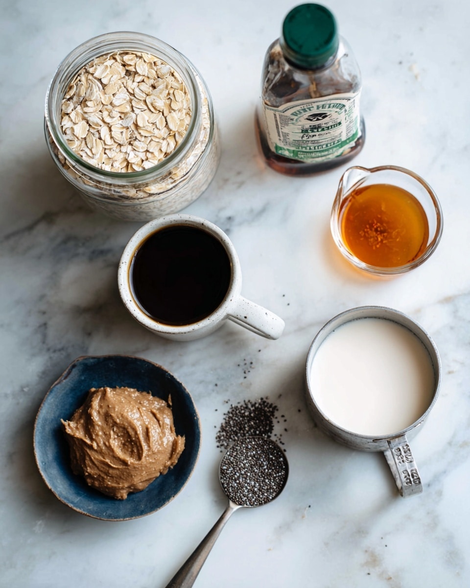 The image shows several ingredients on a white marbled surface, including a clear glass jar filled with light brown oats on the left side, a small white cup filled with black coffee next to it, and a small dark blue bowl holding a thick brown paste. Near the front, a silver measuring spoon filled with tiny black and white chia seeds is placed. To the right, there is a small clear glass container with amber-colored syrup, a metal measuring cup filled with white milk, and a small amber bottle of vanilla extract with a green label in the background. Photo taken with an iphone --ar 4:5 --v 7