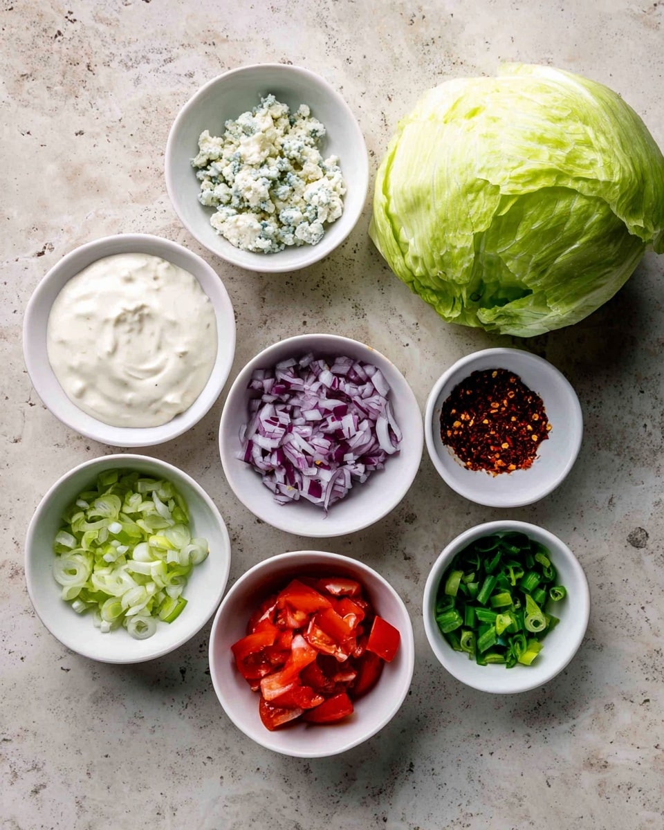 The image shows seven small white bowls arranged on a white marbled surface. The largest bowl on the right contains a whole head of light green iceberg lettuce with a smooth texture. Surrounding it are six smaller white bowls: one with white creamy sauce, one with crumbled pale blue cheese, and one with bright red tomato wedges. Other bowls hold finely chopped dark red onions, green sliced scallions, and reddish-brown dried chili flakes. The bowls are spaced evenly, showing a variety of fresh and colorful ingredients. Photo taken with an iphone --ar 4:5 --v 7