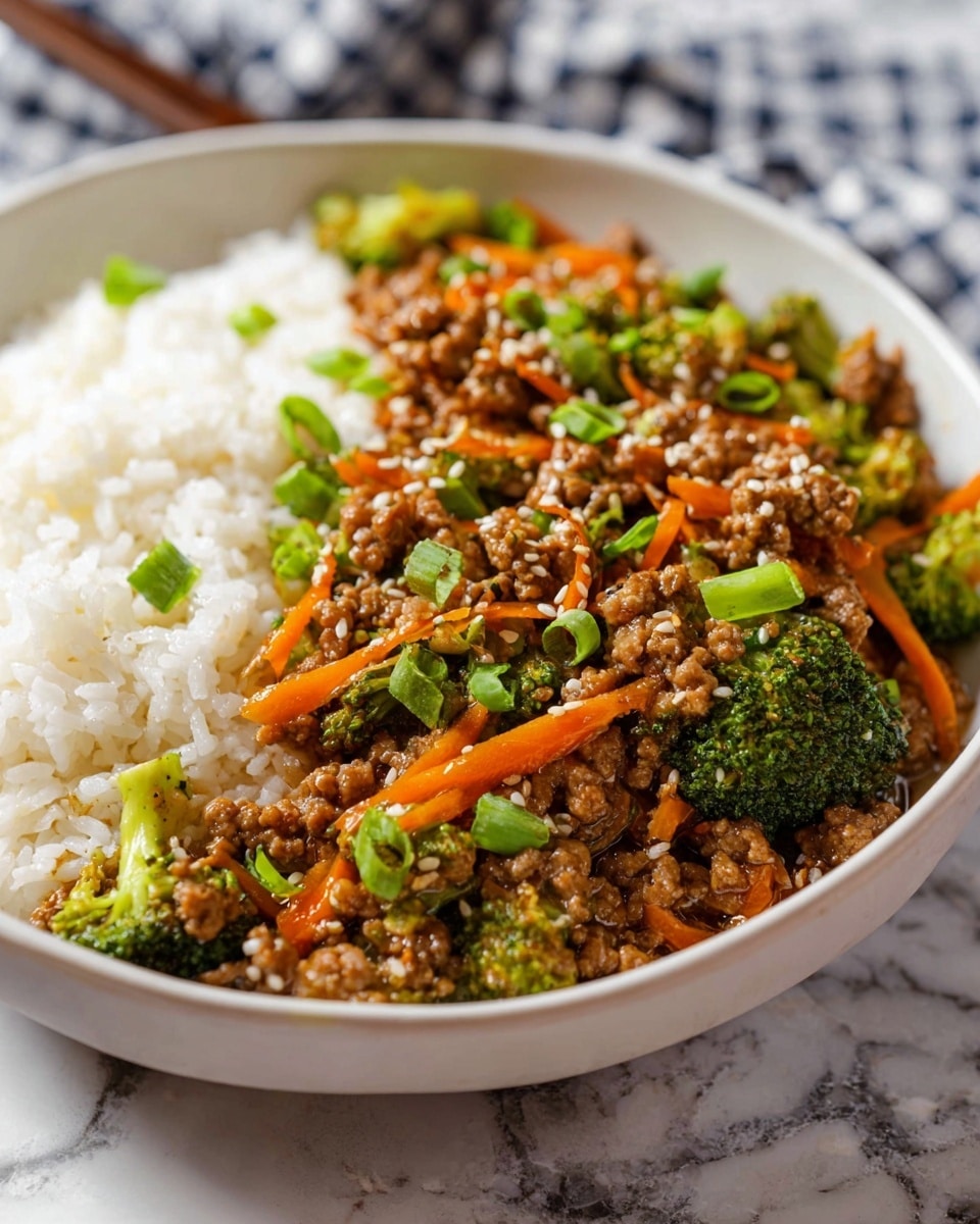 A white bowl filled with three main layers: on the left is a thick layer of cooked white rice; on the right and center is a mix of cooked ground meat pieces with a glossy brown sauce, bright orange thin carrot strips, and small green broccoli florets; the dish is topped with chopped green onions and sprinkled with white sesame seeds. The bowl rests on a white marbled surface with a blurred checkered cloth in the background. Photo taken with an iphone --ar 4:5 --v 7
