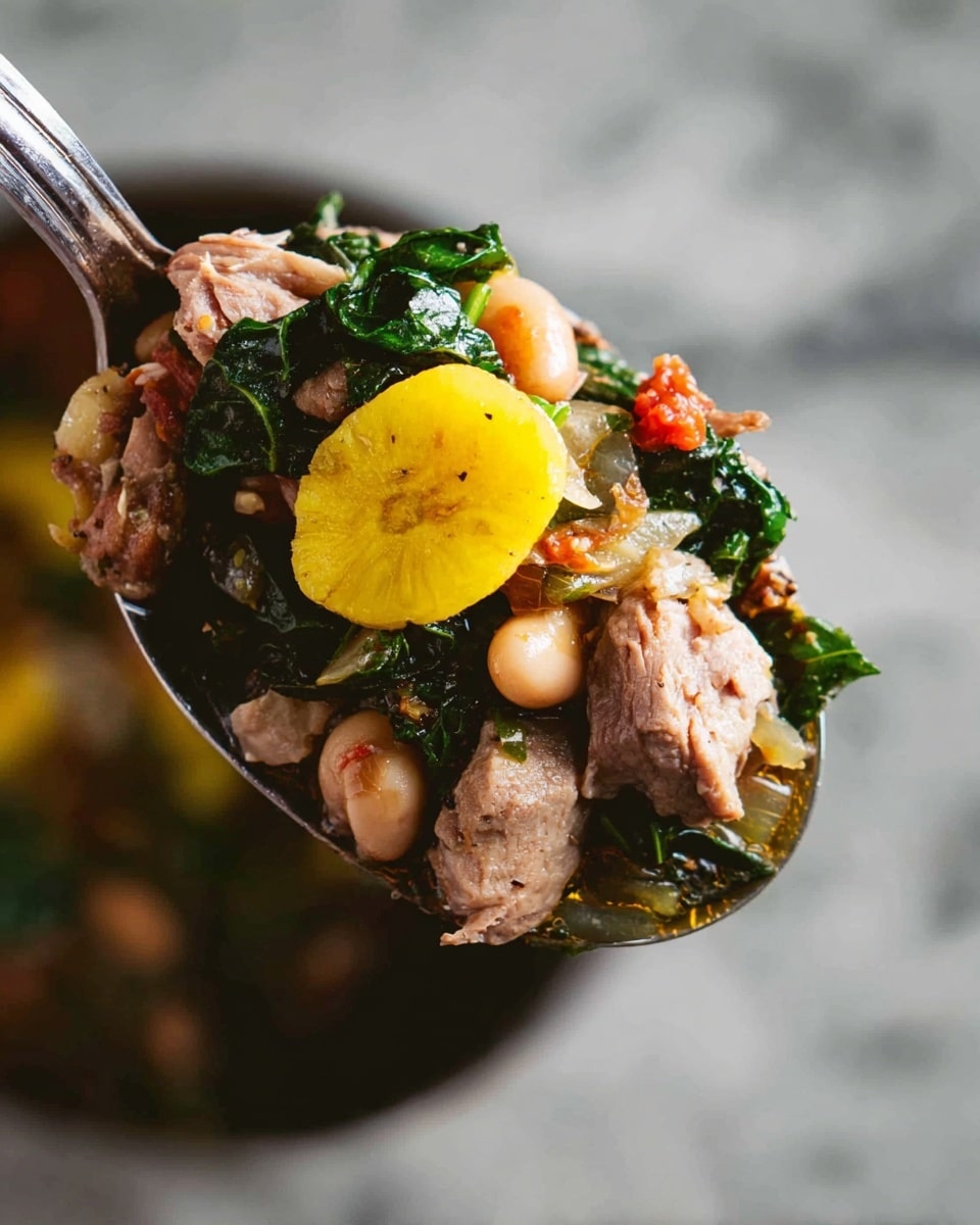 A close-up of a metal spoon filled with a rich stew showing several layers: at the top center is a bright yellow round slice of plantain, surrounded by tender pieces of light brown meat. Beneath and around the meat are dark green leafy vegetables and chunks of light-colored beans. There are also pieces of translucent onion and small bits of red tomato mixed within. The spoon is held against a soft-focus white marbled surface background. Photo taken with an iphone --ar 4:5 --v 7