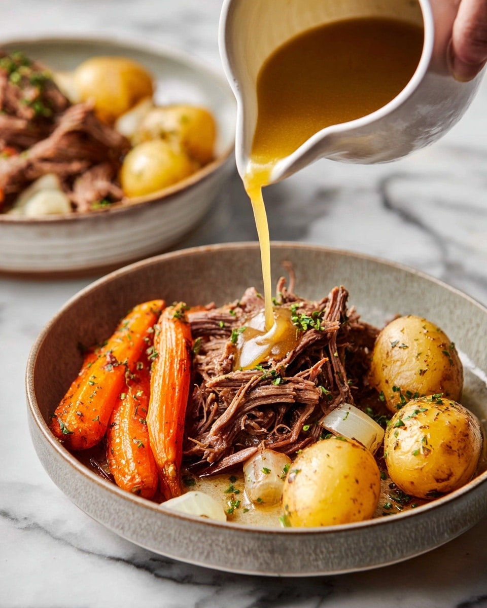 A bowl with a layer of shredded brown meat at the bottom, topped with three roasted golden-brown baby potatoes on the right side and three orange roasted carrot sticks above them, scattered pieces of cooked onion with a light translucent color are placed around the potatoes and carrots. A golden sauce is being poured from a white small jug held by a woman's hand, dripping over the meat and vegetables. The dish is garnished with small green herbs sprinkled on top. The bowl is placed on a white marbled surface with another similar bowl blurred in the back. Photo taken with an iphone --ar 4:5 --v 7