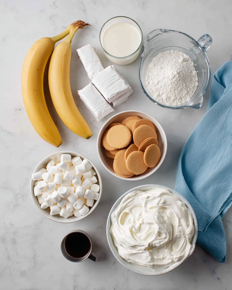 The image shows ingredients neatly arranged on a white marbled surface. There are two yellow bananas on the left, with two white bowls nearby—one filled with small white marshmallows and the other with round, light brown vanilla wafers. Above them, there are two wrapped white sticks of butter stacked side by side. To their right, there is a glass measuring cup filled with white milk. Above that is a small white bowl piled high with powdered sugar, and next to it is a small metallic cup with a dark liquid inside. At the bottom of the image, a white bowl is full of thick, white whipped cream. A light blue cloth is folded and placed toward the right edge of the image. The photo has soft lighting and is taken from above. photo taken with an iphone --ar 4:5 --v 7