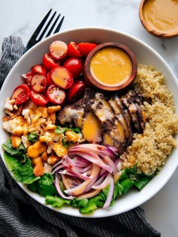 Steak Bowl Recipe with Tender Steak, Quinoa, Tomatoes, Onions, and Hot Honey Sauce Recipe